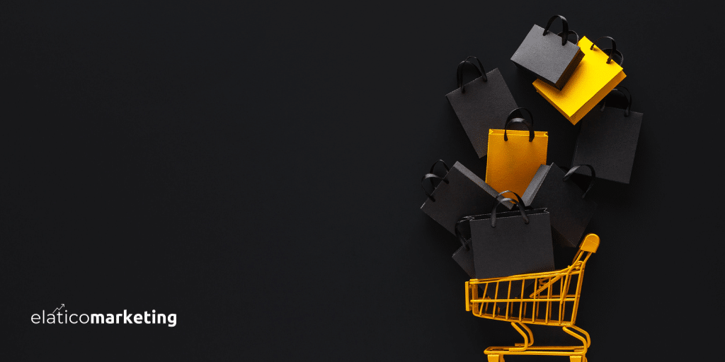 Black Friday. Imagen de fondo negro con un carrito de la compra en color yema. Sobre el carrito caen bolsas de la compra de color negro y yema o amarillo.